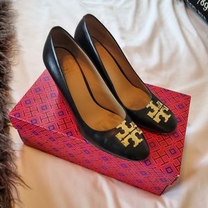 Black and gold Tory Burch wedges